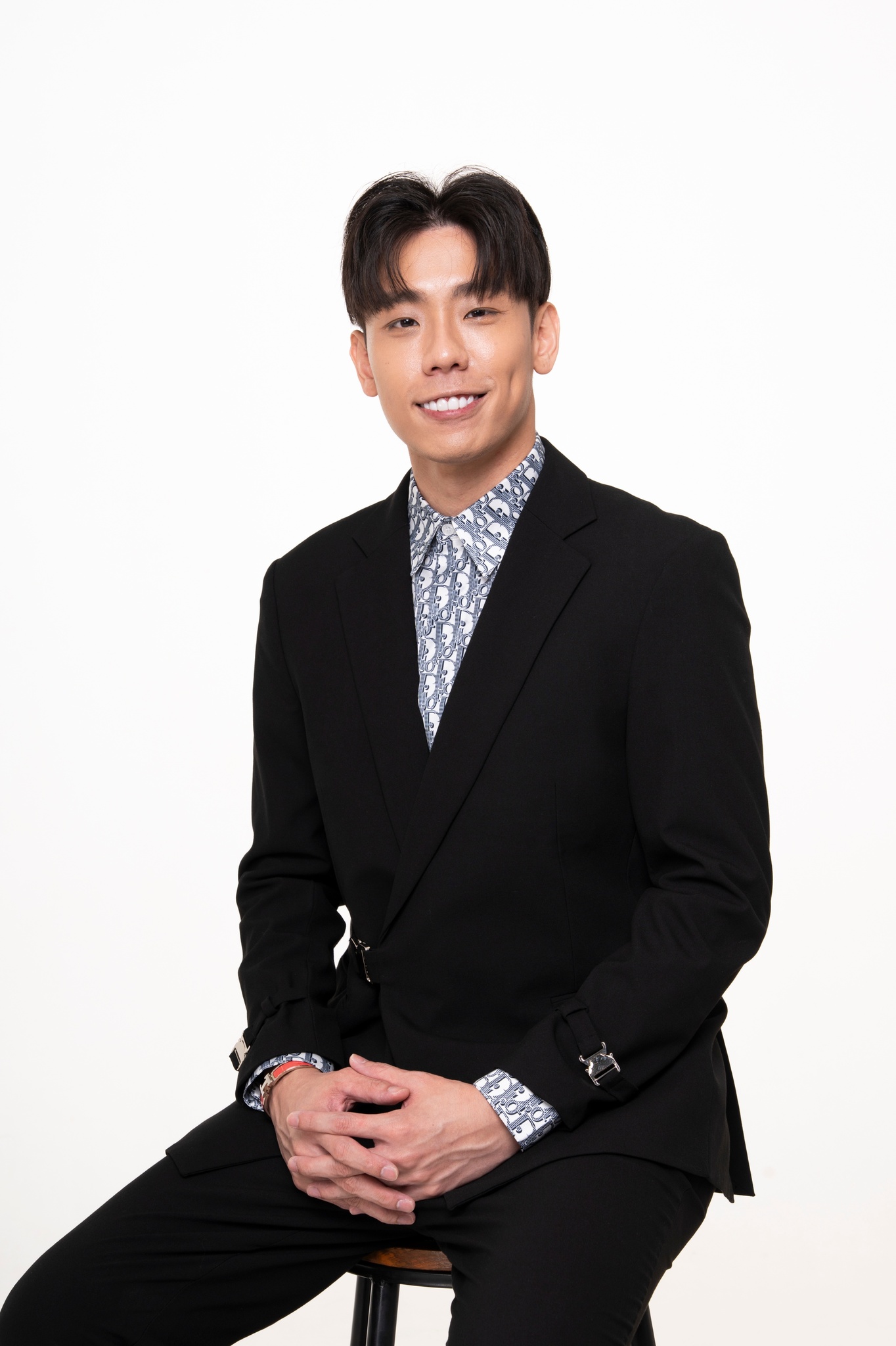 Sean Ho, seated studio portrait