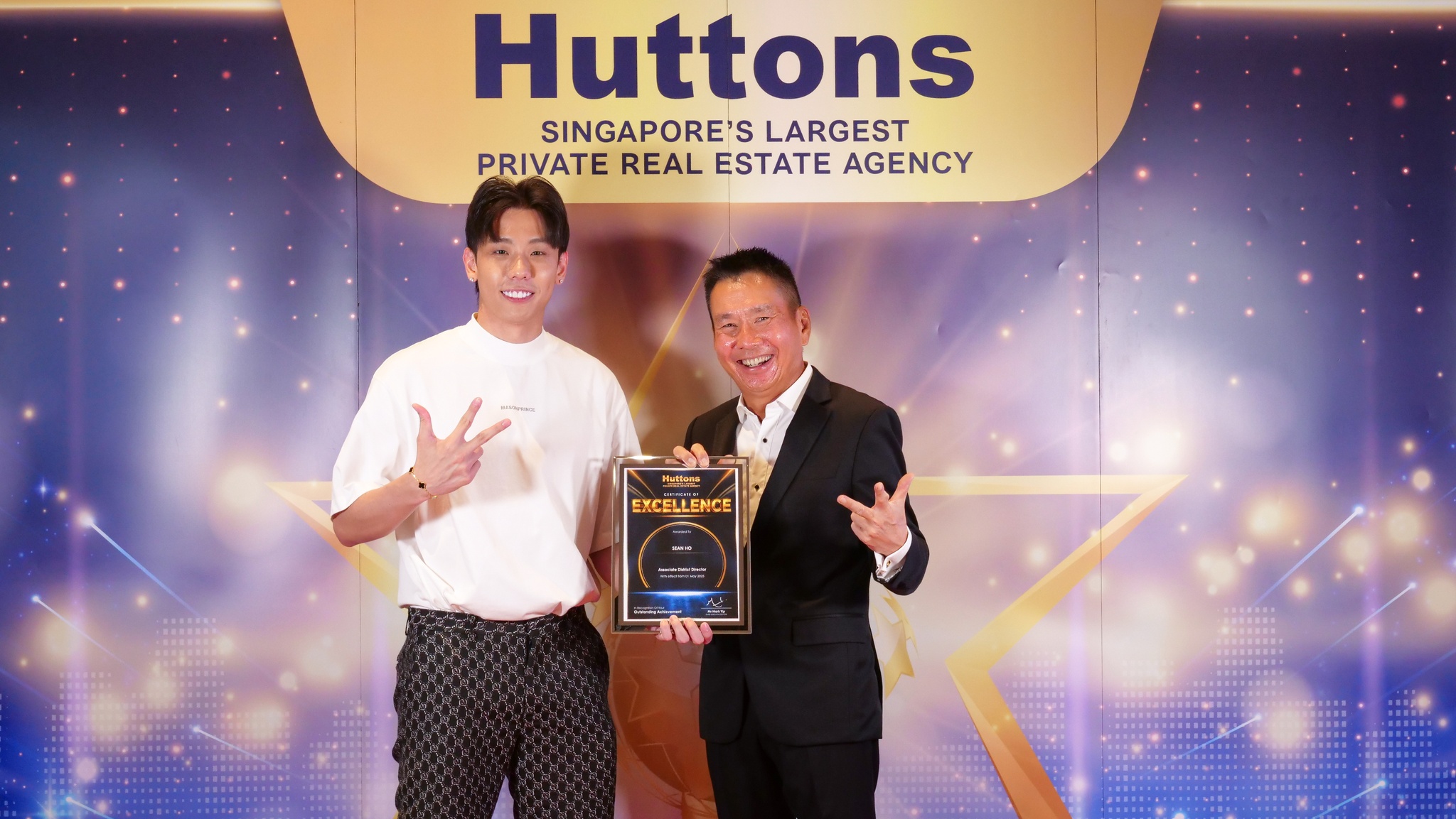 Sean Ho receiving his Certificate of Excellence on promotion to Associate District Director